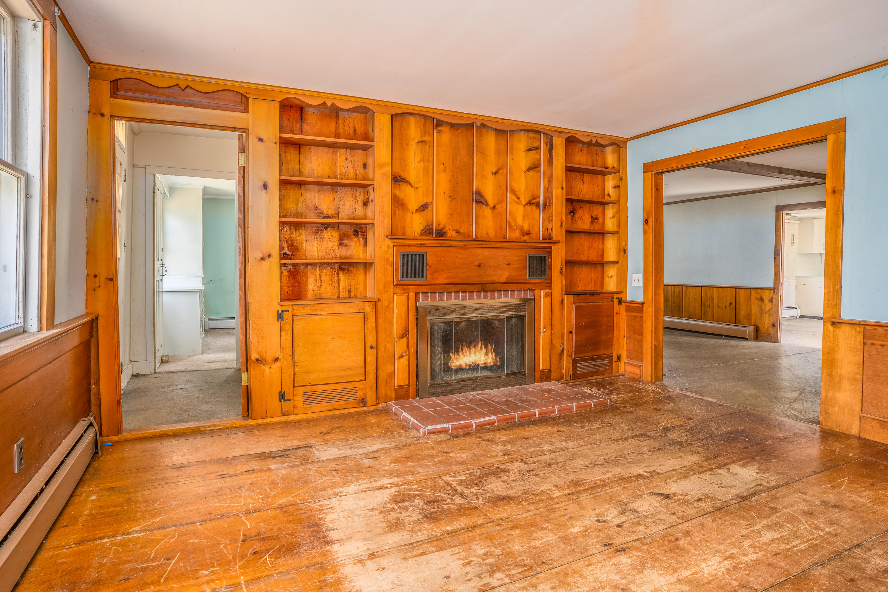 337 South Main Street Centerville, MA 02632 - Photo 2 of 19 a view of empty room with a fireplace and wooden floor