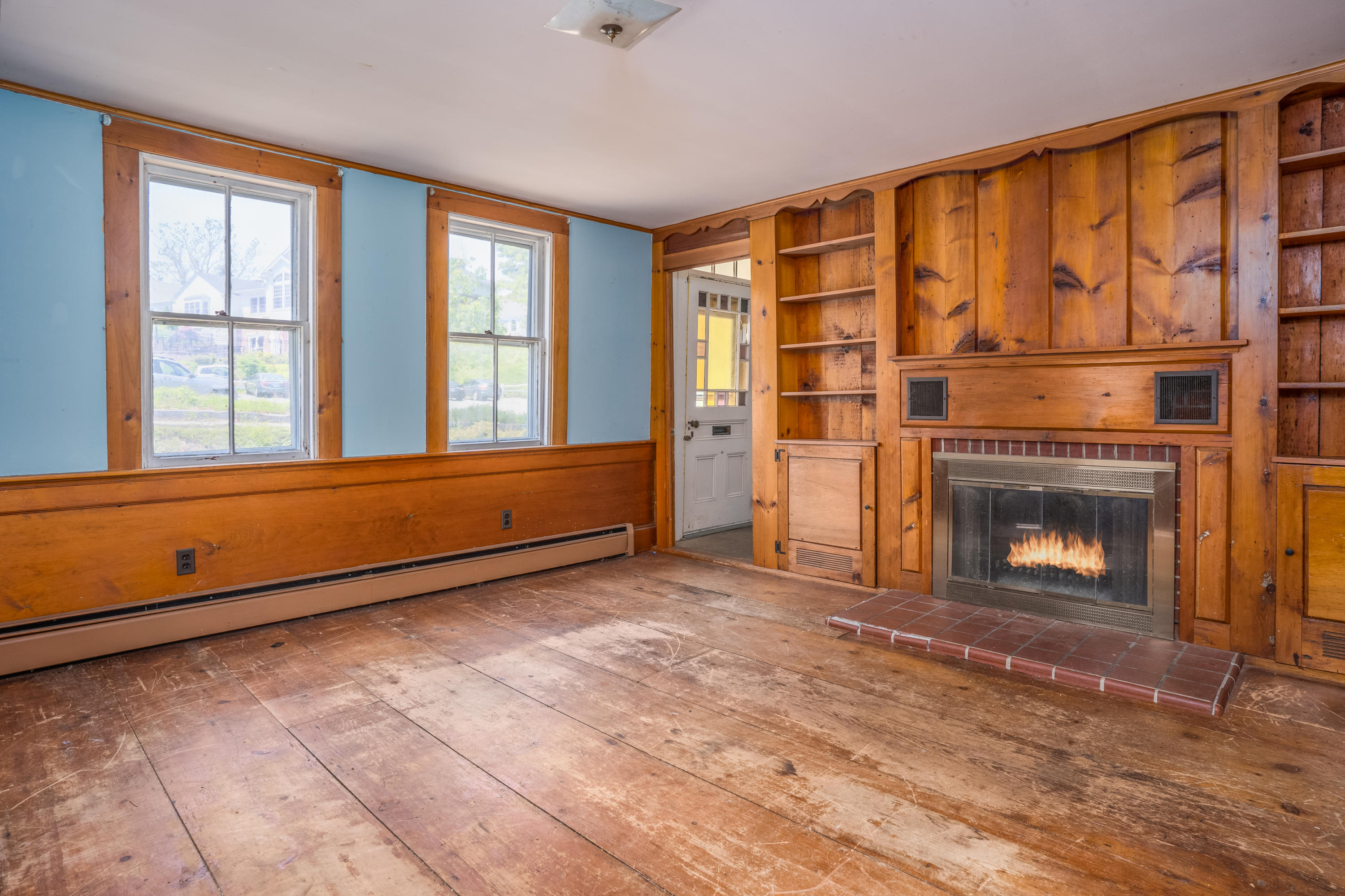 337 South Main Street Centerville, MA 02632 - Photo 4 of 19 a view of an empty room with a fireplace and a window