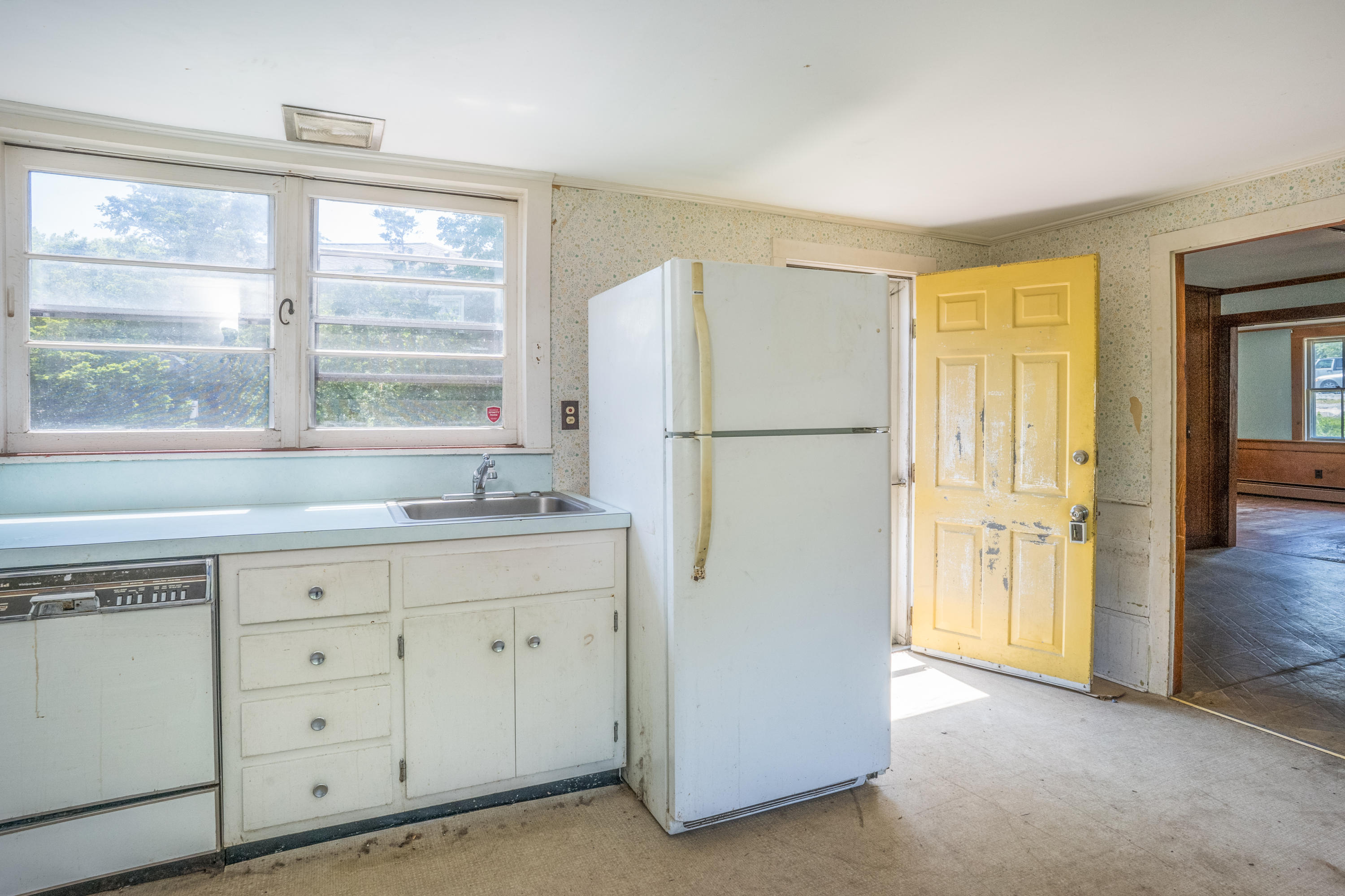 337 South Main Street Centerville, MA 02632 - Photo 8 of 19 a kitchen with cabinets appliances and a window