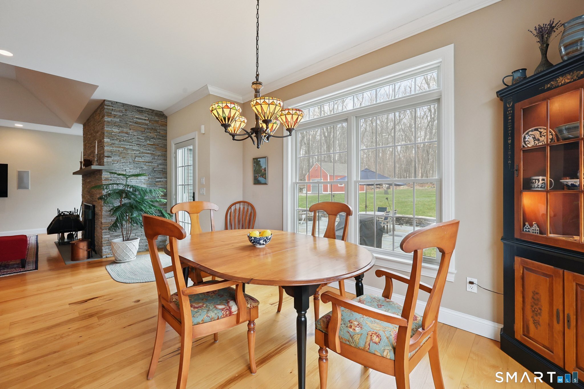 15 Mains Way Preston, CT 06365 - Photo 12 of 40 a view of a dining room with furniture wooden floor and chandelier