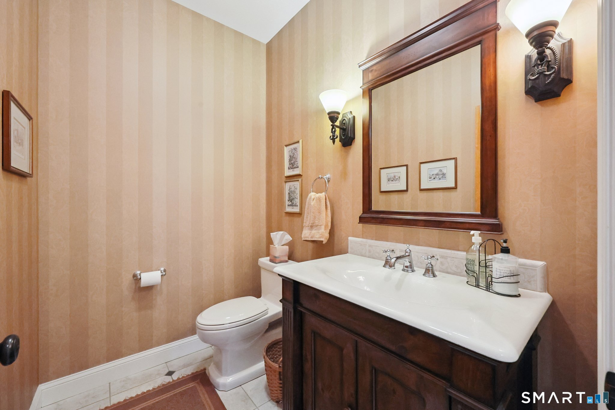 15 Mains Way Preston, CT 06365 - Photo 17 of 40 a bathroom with a sink a toilet and mirror
