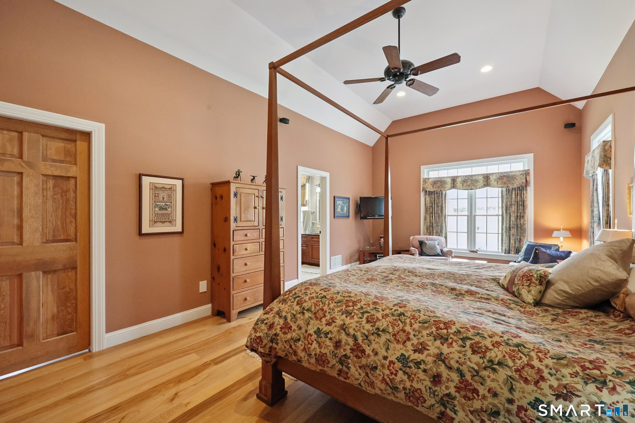 15 Mains Way Preston, CT 06365 - Photo 19 of 40 a bedroom with a bed and a chandelier