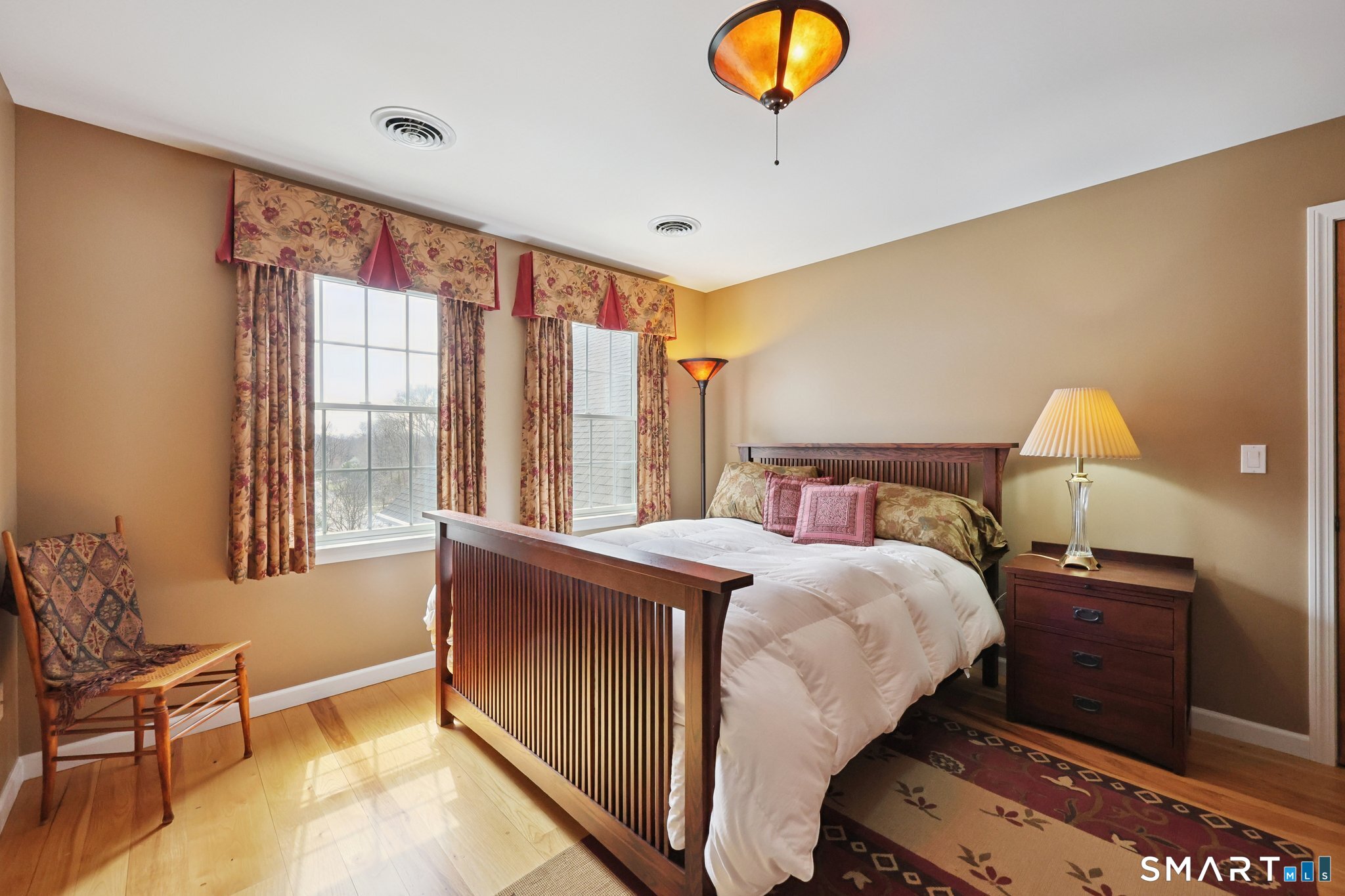15 Mains Way Preston, CT 06365 - Photo 25 of 40 a bedroom with a bed and a chandelier