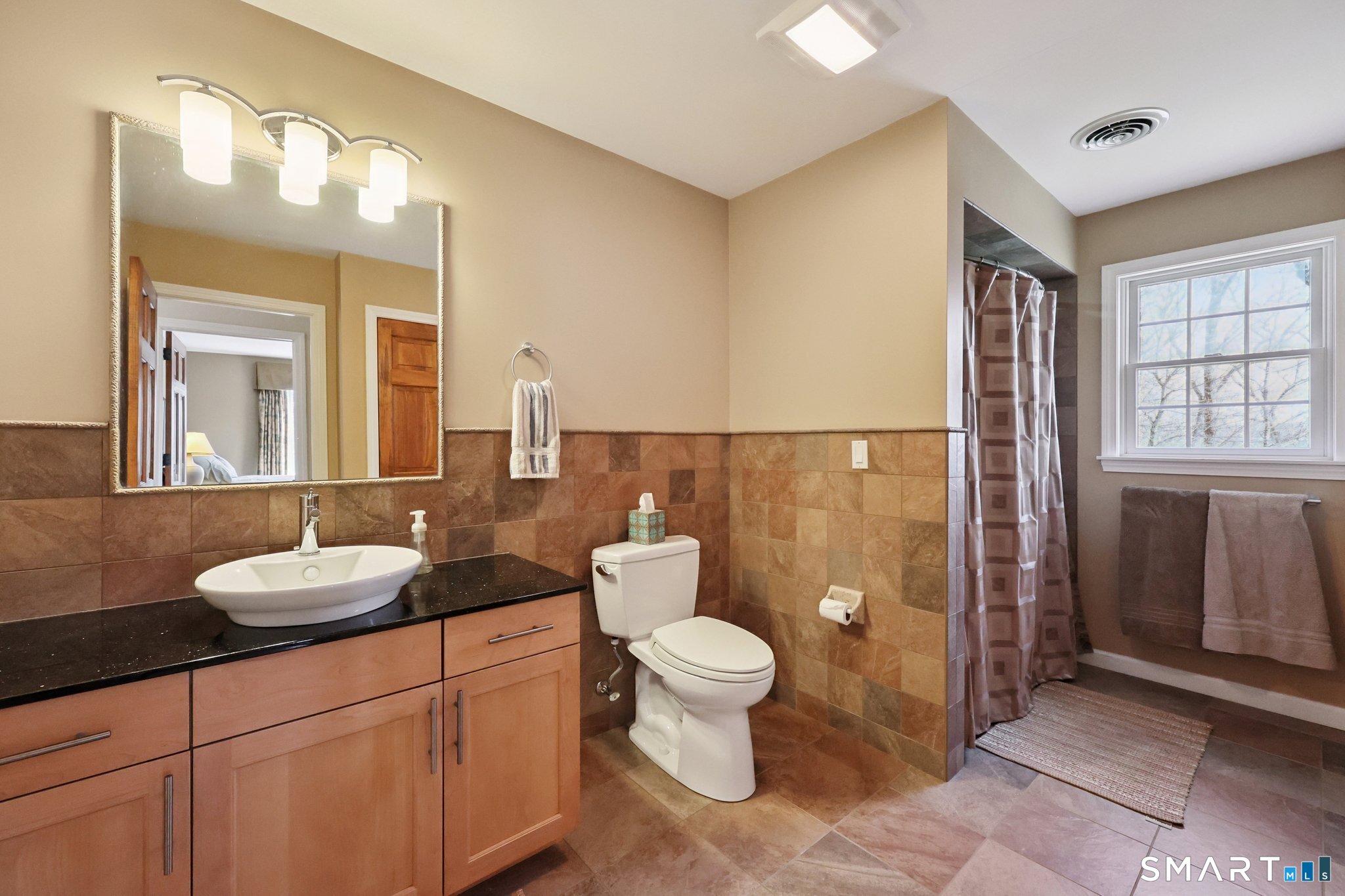 15 Mains Way Preston, CT 06365 - Photo 29 of 40 a bathroom with a granite countertop toilet sink and mirror