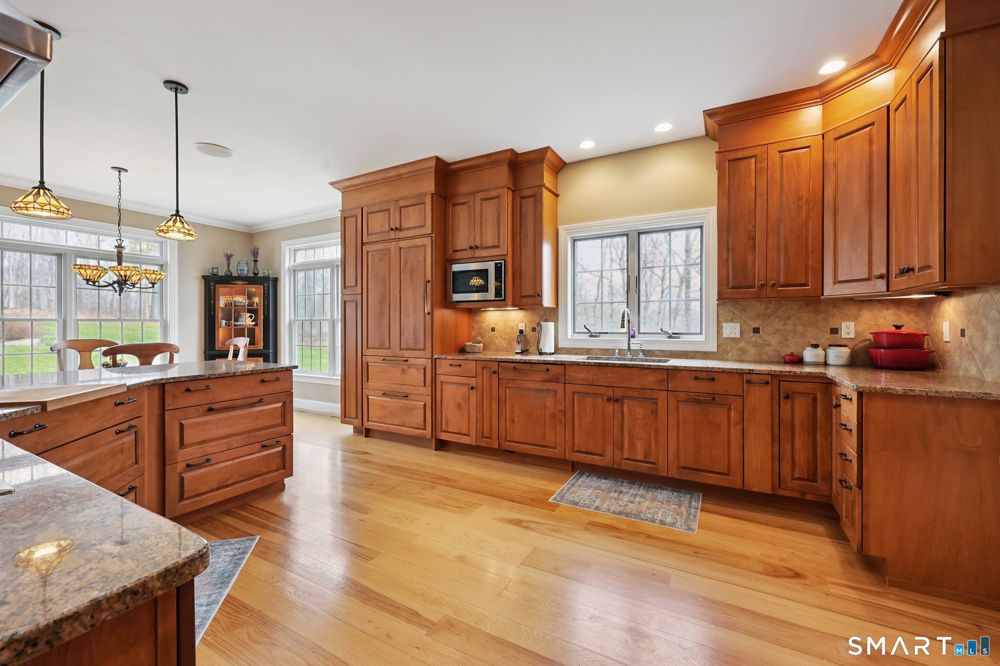 15 Mains Way Preston, CT 06365 - Photo 6 of 40 a kitchen with stainless steel appliances granite countertop a stove a sink and a refrigerator