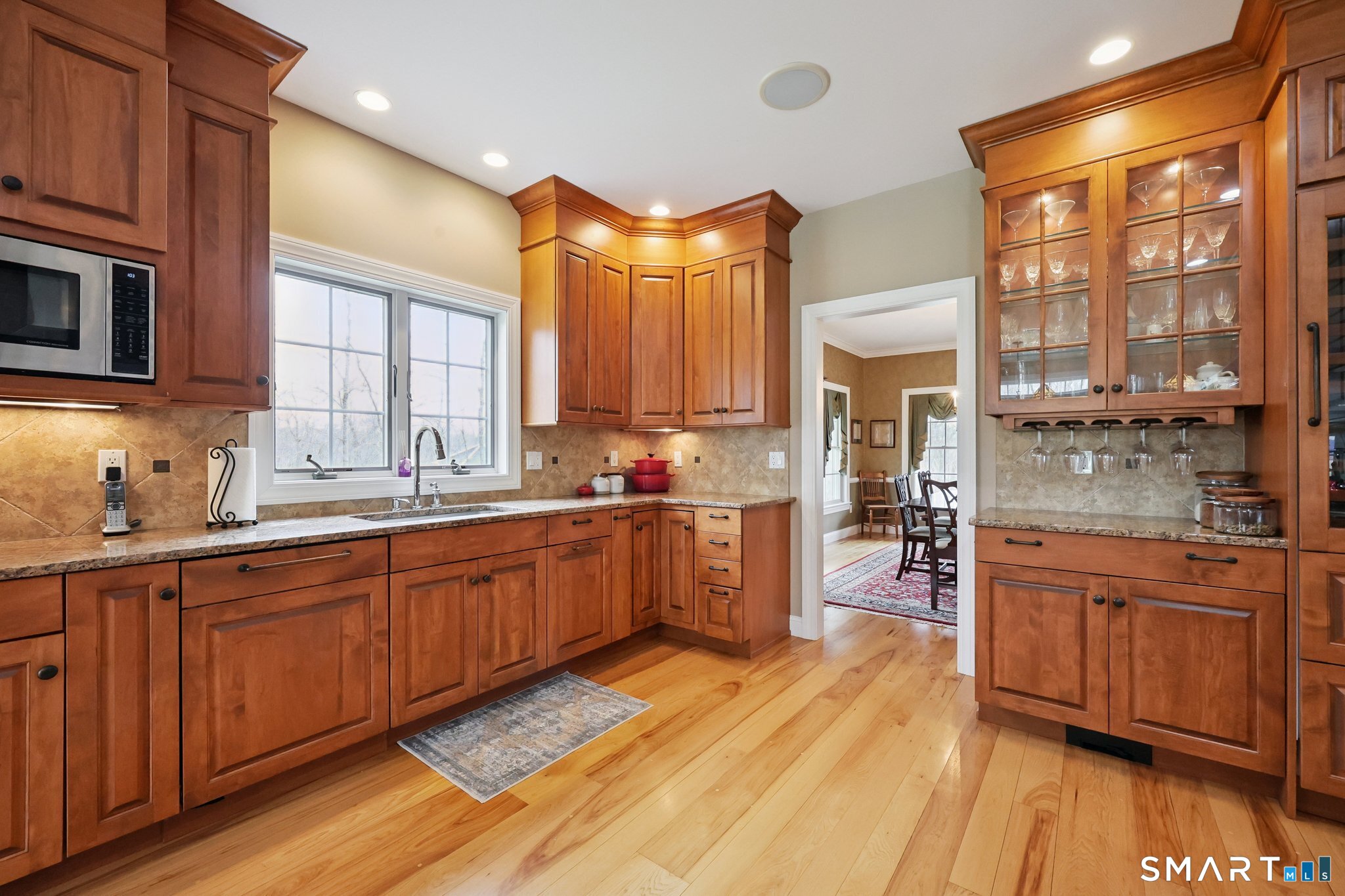 15 Mains Way Preston, CT 06365 - Photo 7 of 40 a large kitchen with kitchen island granite countertop wooden floors and stainless steel appliances