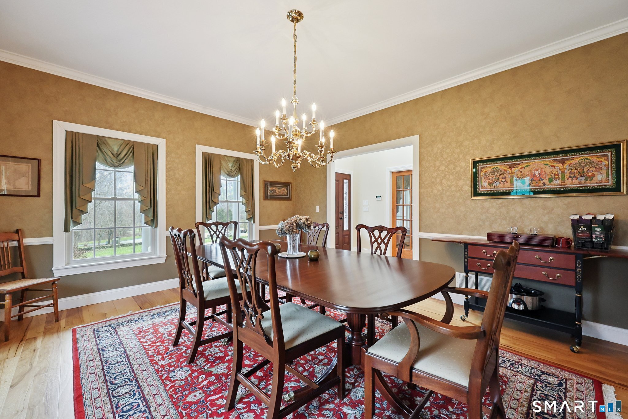 15 Mains Way Preston, CT 06365 - Photo 9 of 40 a dining room with furniture a rug and a chandelier
