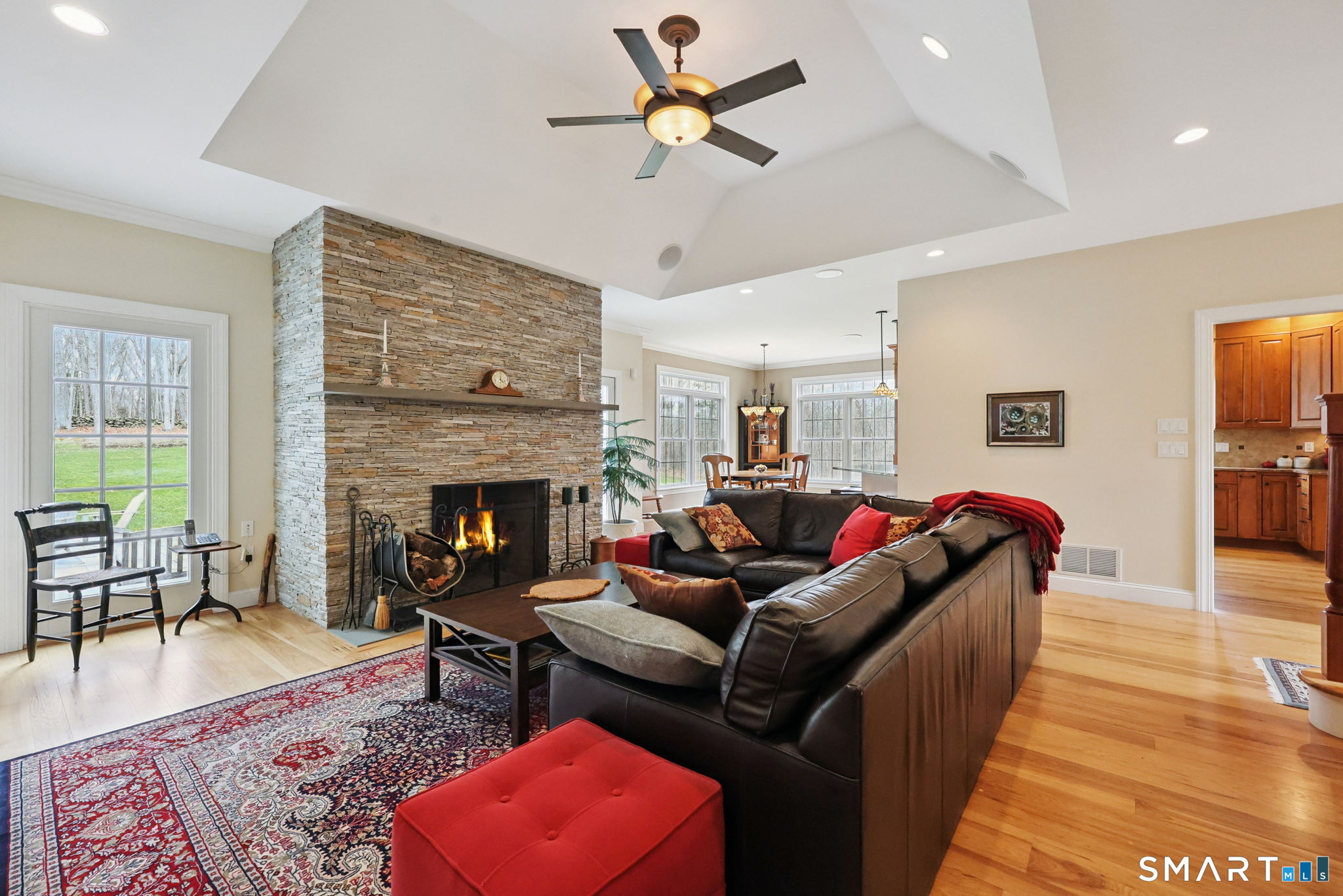 15 Mains Way Preston, CT 06365 - Photo 10 of 40 a living room with furniture wooden floor and a fireplace
