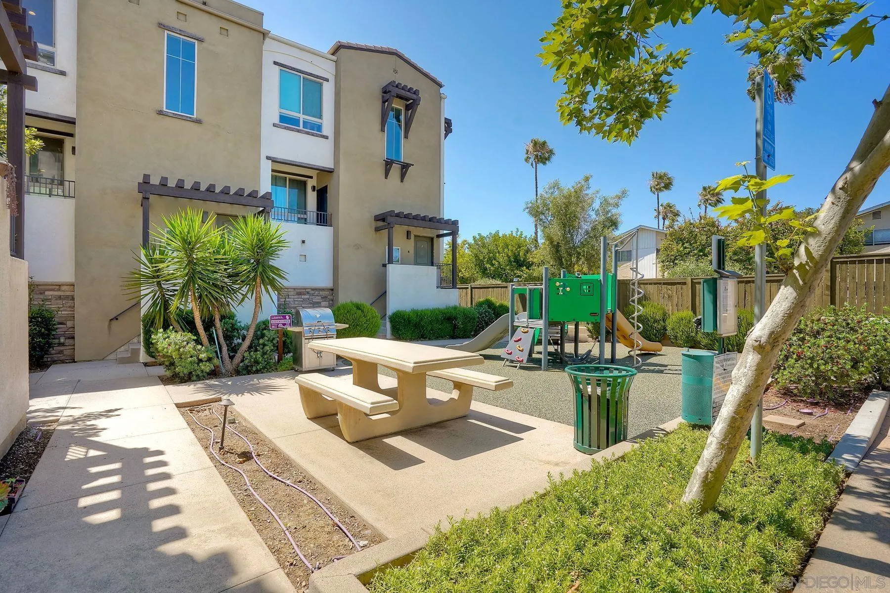 8850 Olive Lane, Unit 7 Santee, CA 92071 - Photo 23 of 27 a view of a house with potted plants and a patio