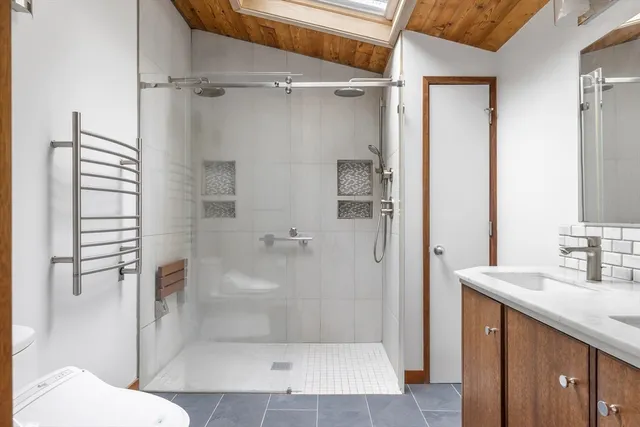 a bathroom with a shower and a toilet