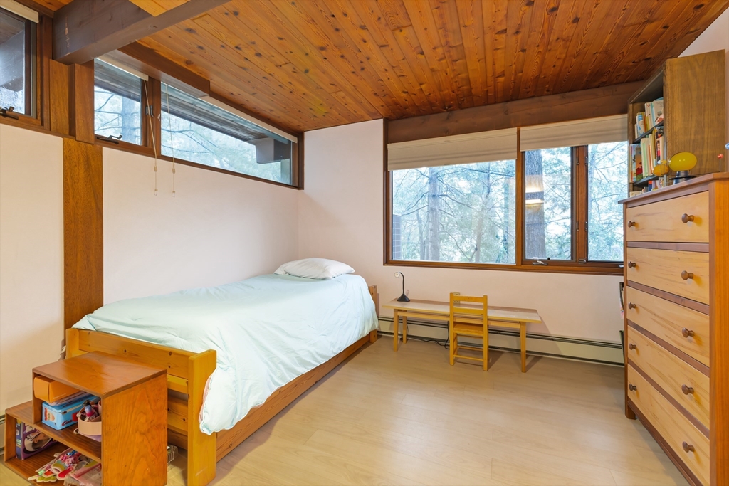 134 Rangeley Road Brookline, MA 02467 - Photo 14 of 20 a bedroom with a bed and a window