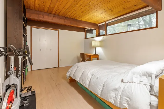 a bedroom with a bed and a view of bathroom