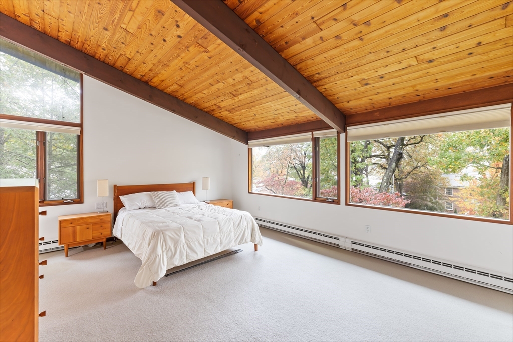 134 Rangeley Road Brookline, MA 02467 - Photo 9 of 20 a bedroom with a bed and large window
