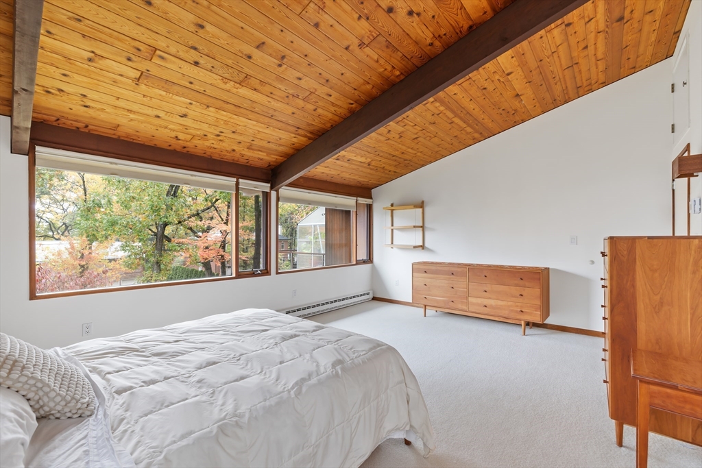 134 Rangeley Road Brookline, MA 02467 - Photo 10 of 20 a bed room with a bed and a large window