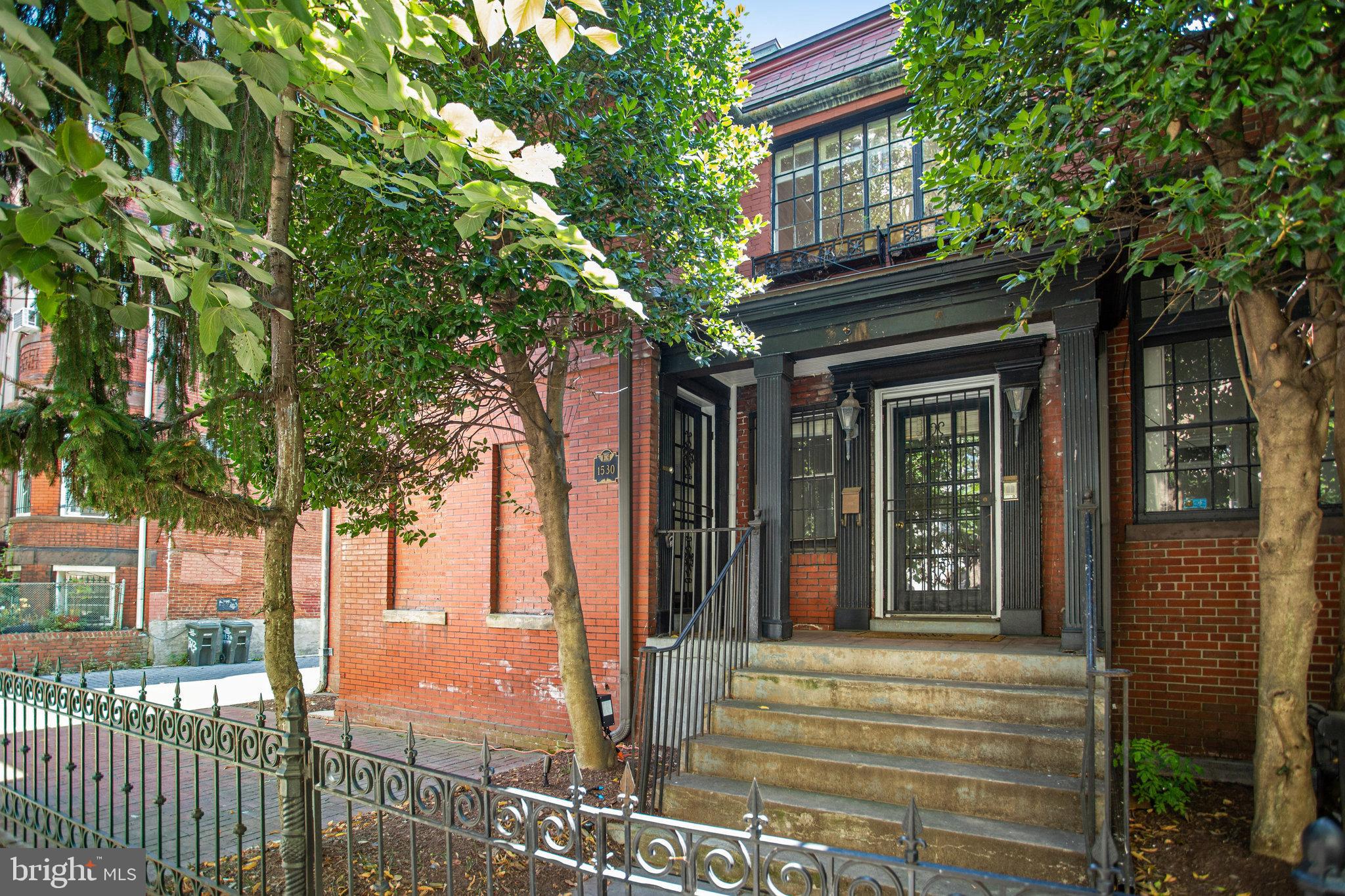 1633 16th Street Northwest Washington, DC 20009 - Photo 127 of 130 a front view of a house with a tree