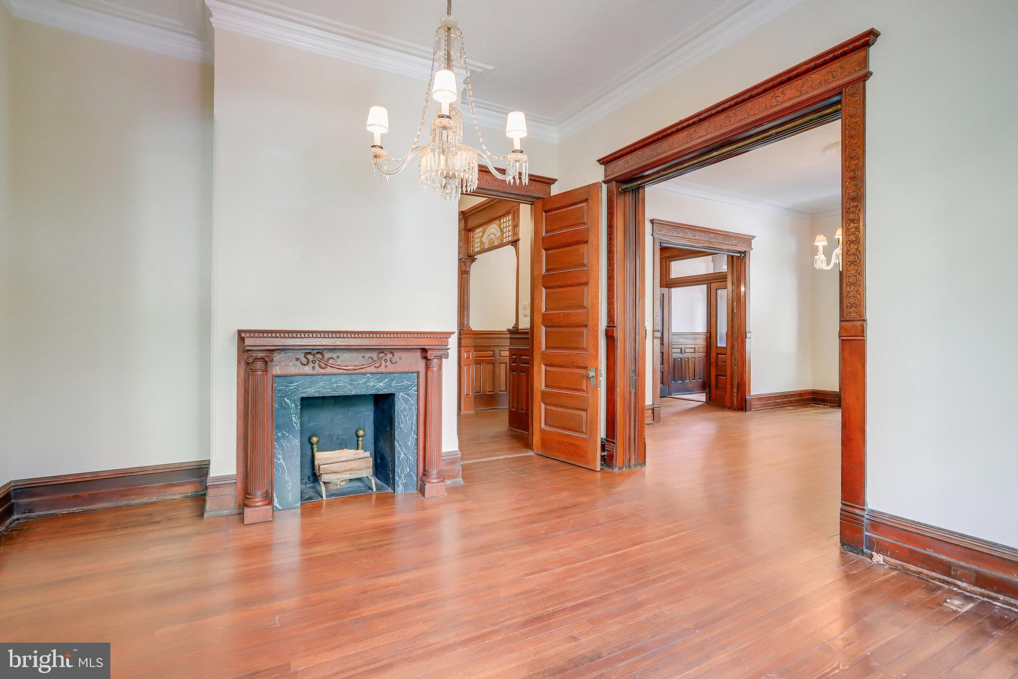 1633 16th Street Northwest Washington, DC 20009 - Photo 19 of 130 a view of a livingroom with wooden floor and a fireplace