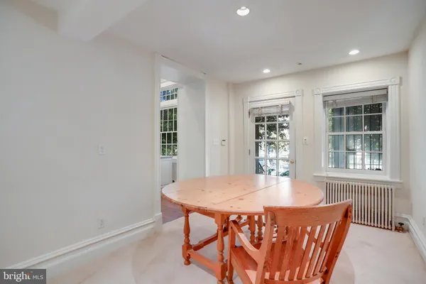 a view of entryway with wooden floor and stairs