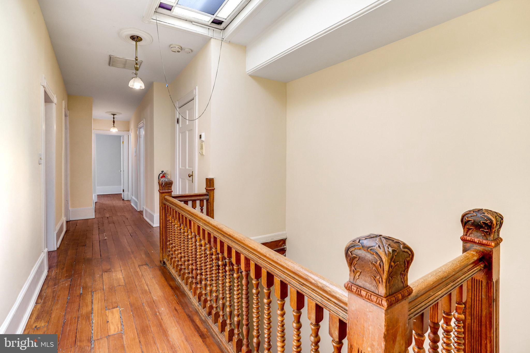 1633 16th Street Northwest Washington, DC 20009 - Photo 87 of 130 a view of a hallway with wooden floor and staircase