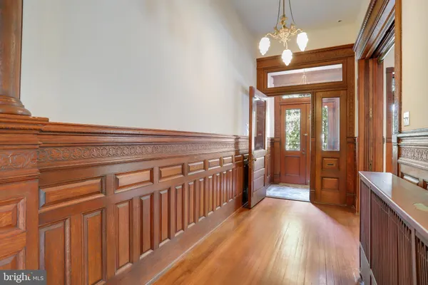 a bathroom with a granite countertop toilet sink a mirror and vanity
