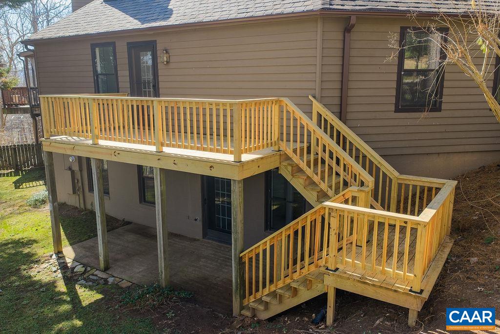 751 Exton Court Charlottesville, VA 22901 - Photo 11 of 42 a view of a house with backyard and deck