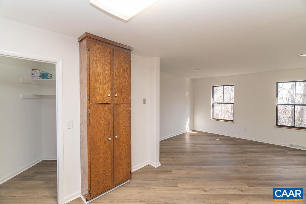 751 Exton Court Charlottesville, VA 22901 - Photo 17 of 42 an empty room with wooden floor and windows