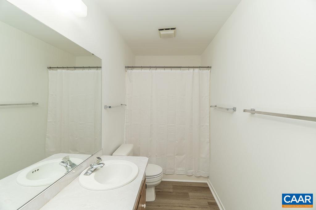 751 Exton Court Charlottesville, VA 22901 - Photo 21 of 42 a bathroom with a sink a toilet a shower and a mirror