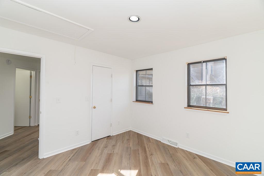 751 Exton Court Charlottesville, VA 22901 - Photo 24 of 42 an empty room with wooden floor and windows