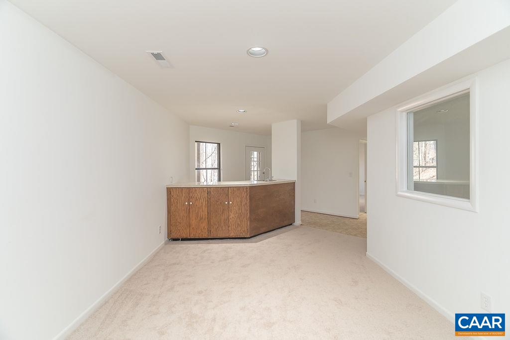 751 Exton Court Charlottesville, VA 22901 - Photo 34 of 42 an empty room with wooden floor and windows