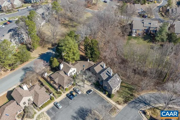 an aerial view of a house with a yard