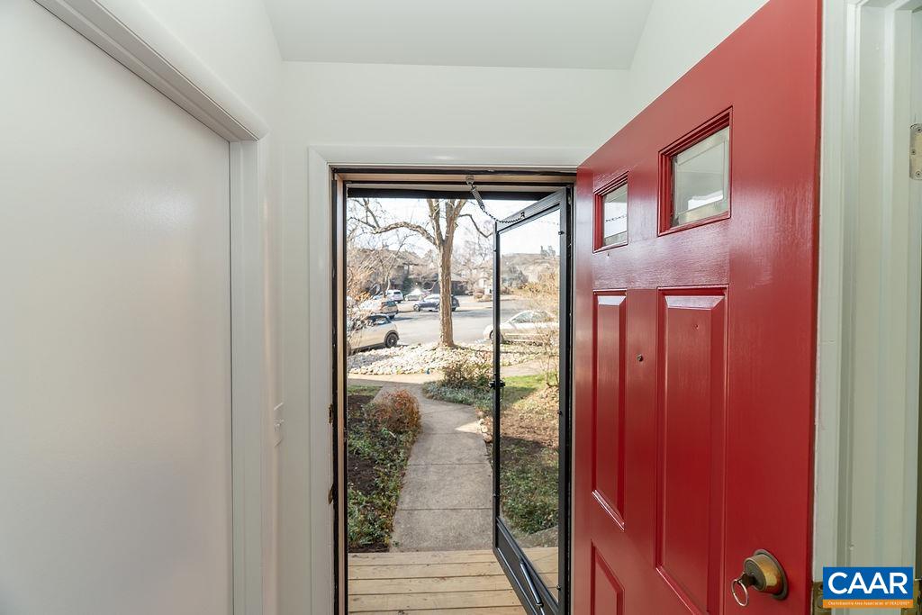 751 Exton Court Charlottesville, VA 22901 - Photo 8 of 42 a view of a hallway with wooden floor and glass door