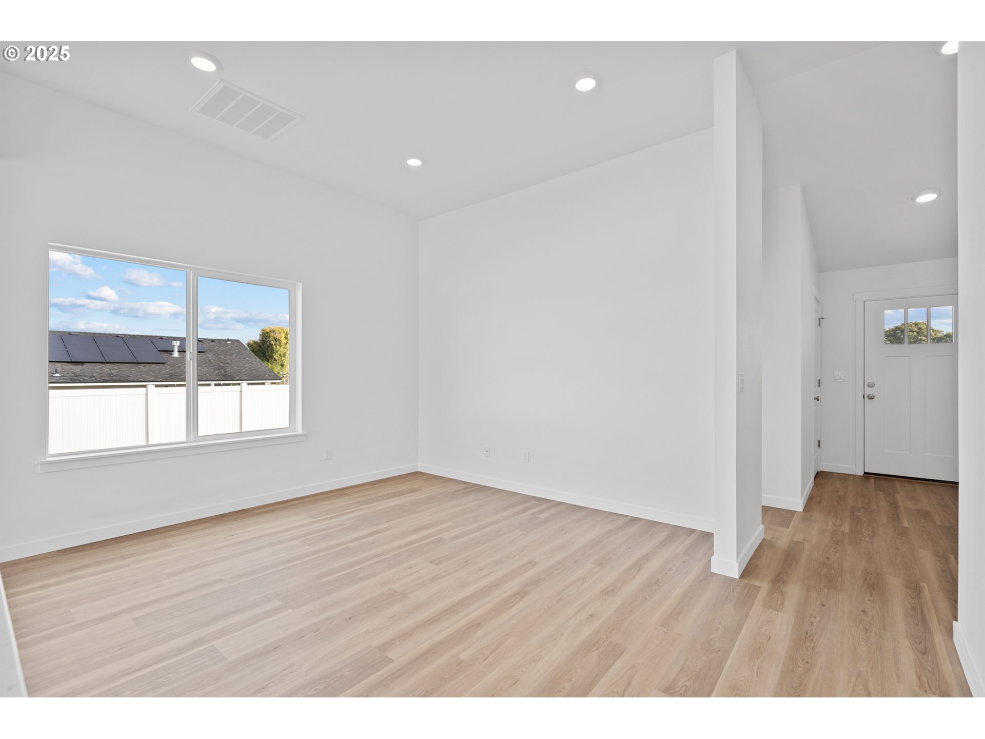 144 Southwest Eagle Drive Boardman, OR 97818 - Photo 15 of 22 a view of an empty room with wooden floor and a window
