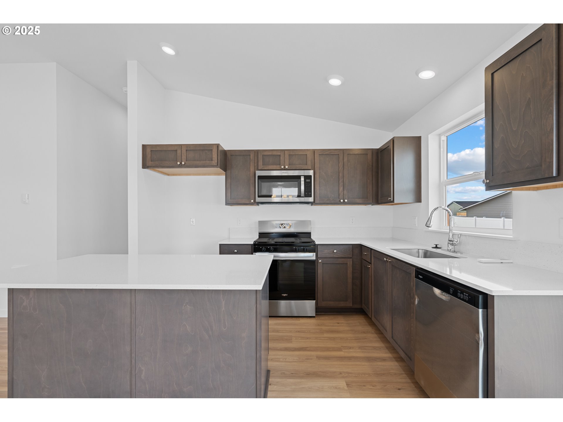 144 Southwest Eagle Drive Boardman, OR 97818 - Photo 7 of 22 a kitchen with stainless steel appliances granite countertop a sink stove and refrigerator