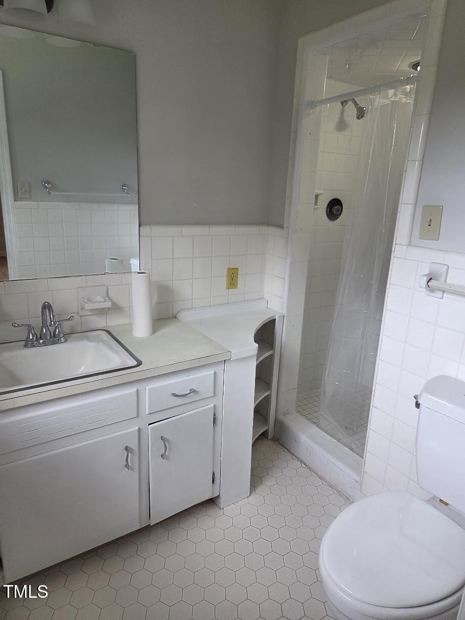 4116 Jane Lane Raleigh, NC 27604 - Photo 15 of 25 a bathroom with a sink toilet and shower