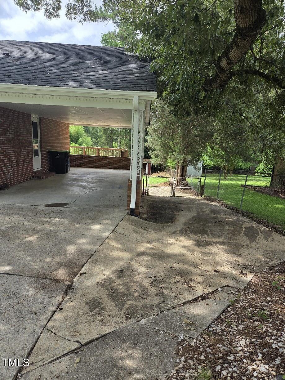 4116 Jane Lane Raleigh, NC 27604 - Photo 4 of 25 a view of a backyard with a garden and plants