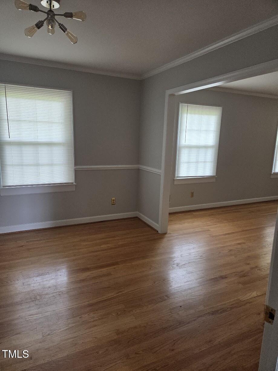 4116 Jane Lane Raleigh, NC 27604 - Photo 5 of 25 an empty room with wooden floor and windows