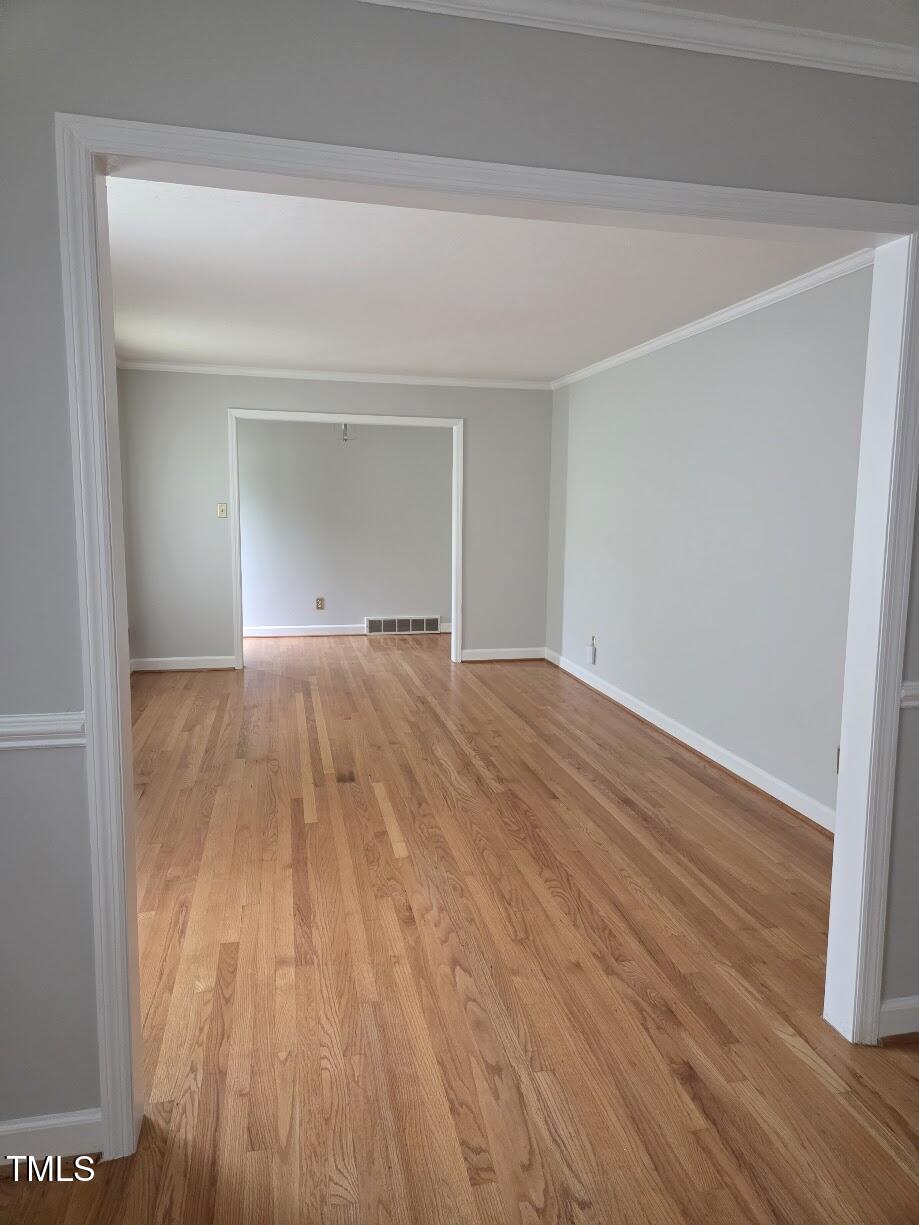 4116 Jane Lane Raleigh, NC 27604 - Photo 6 of 25 a view of empty room with wooden floor and fan