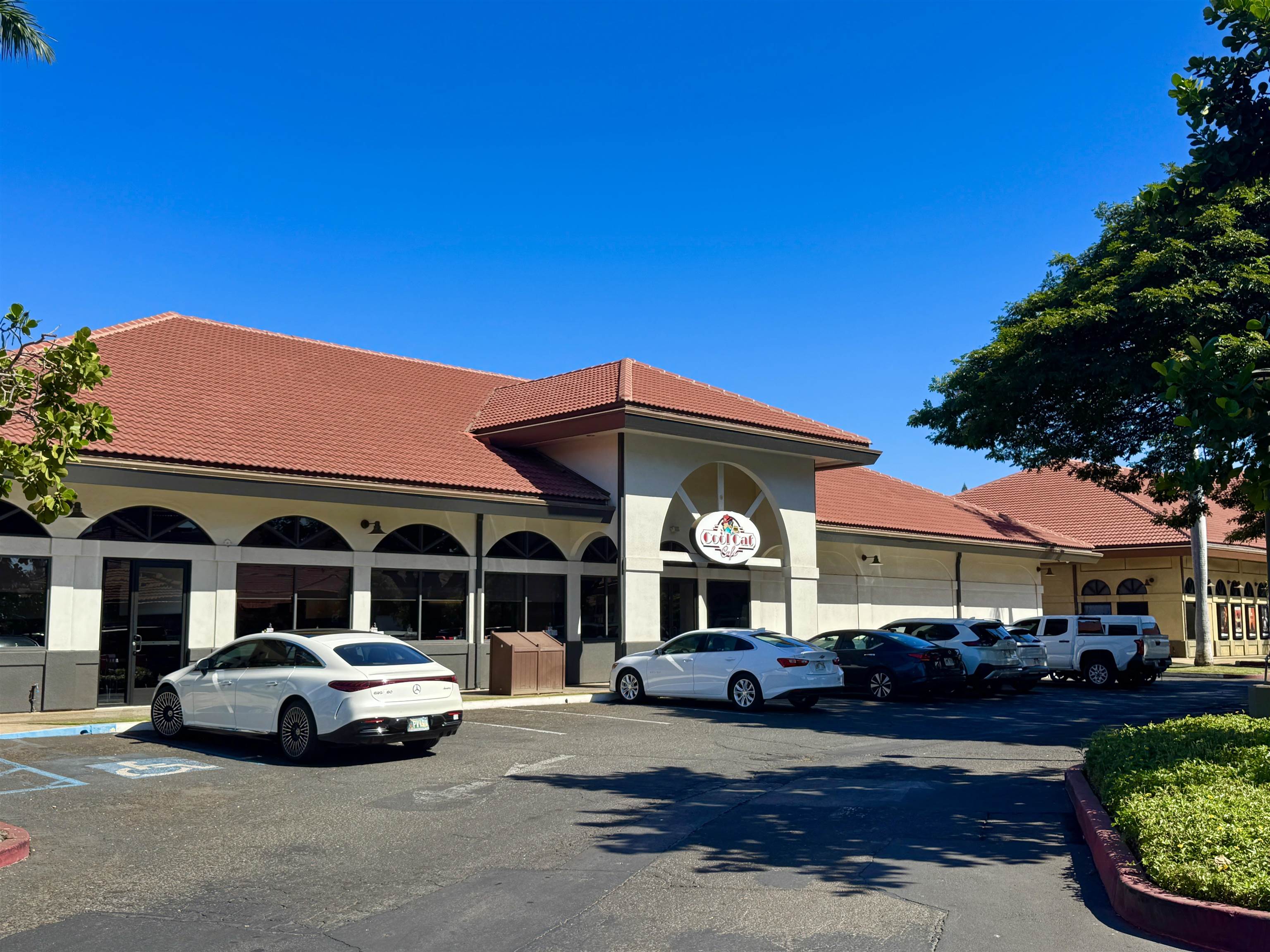 1746 South Kihei Road Kihei, HI 96753 - Photo 30 of 35 a front view of a house with a garden and parking space