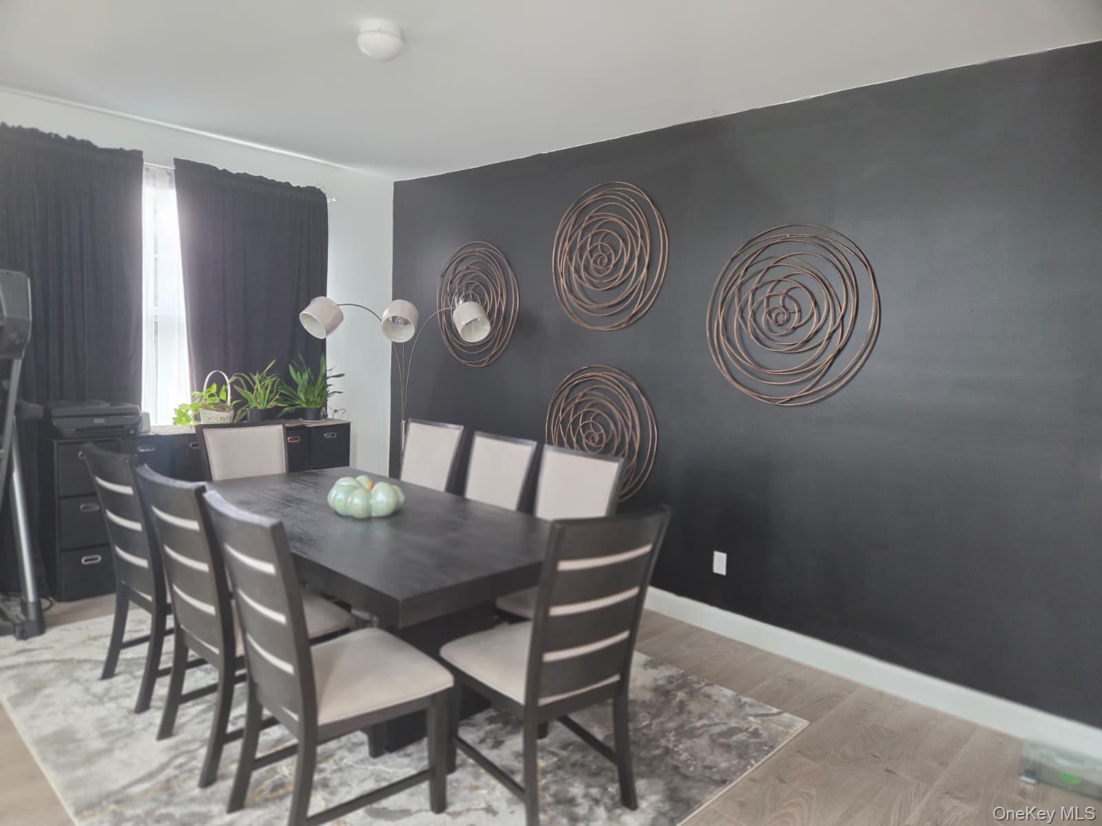 9 Lilac Lane Ridge, NY 11961 - Photo 4 of 9 a view of a dining room with furniture