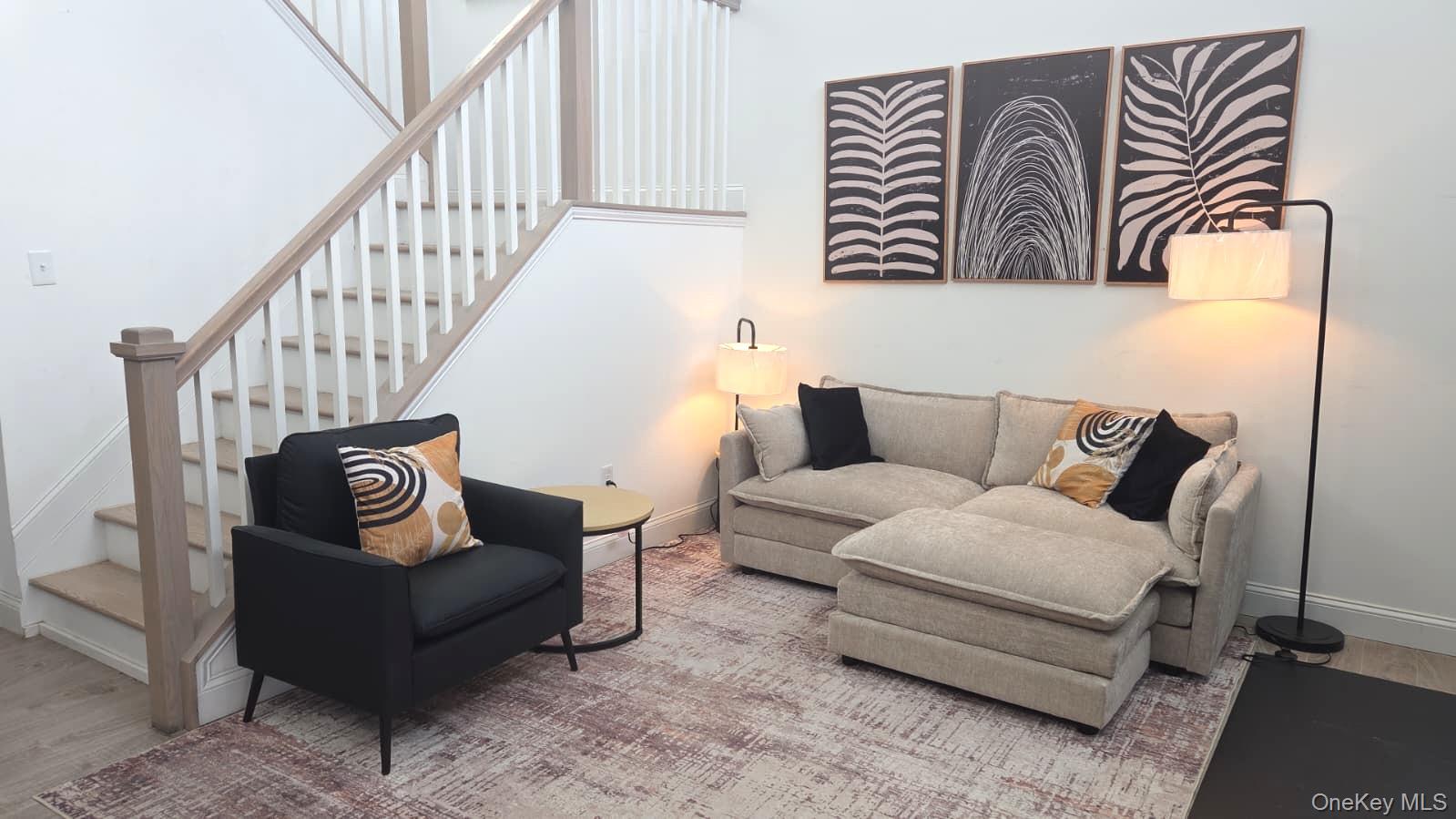 9 Lilac Lane Ridge, NY 11961 - Photo 6 of 9 a living room with furniture and a wooden floor