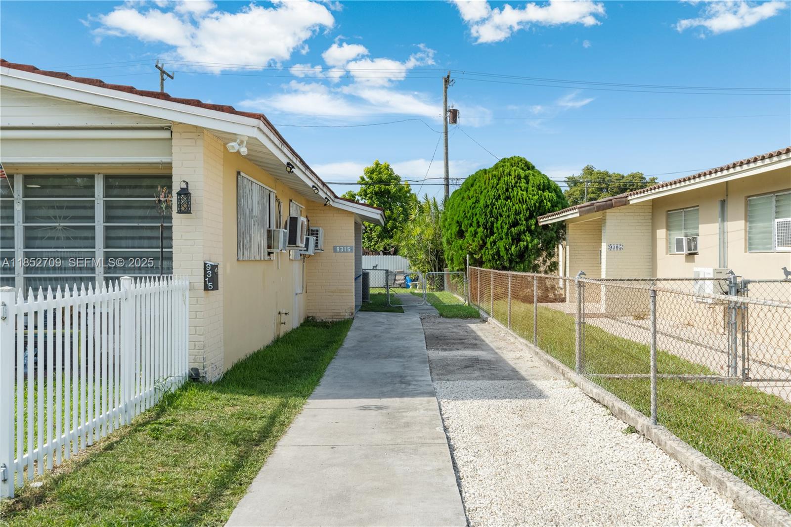 9311 Southwest 37th Street Miami, FL 33165 - Photo 13 of 39 a view of a house with backyard and porch