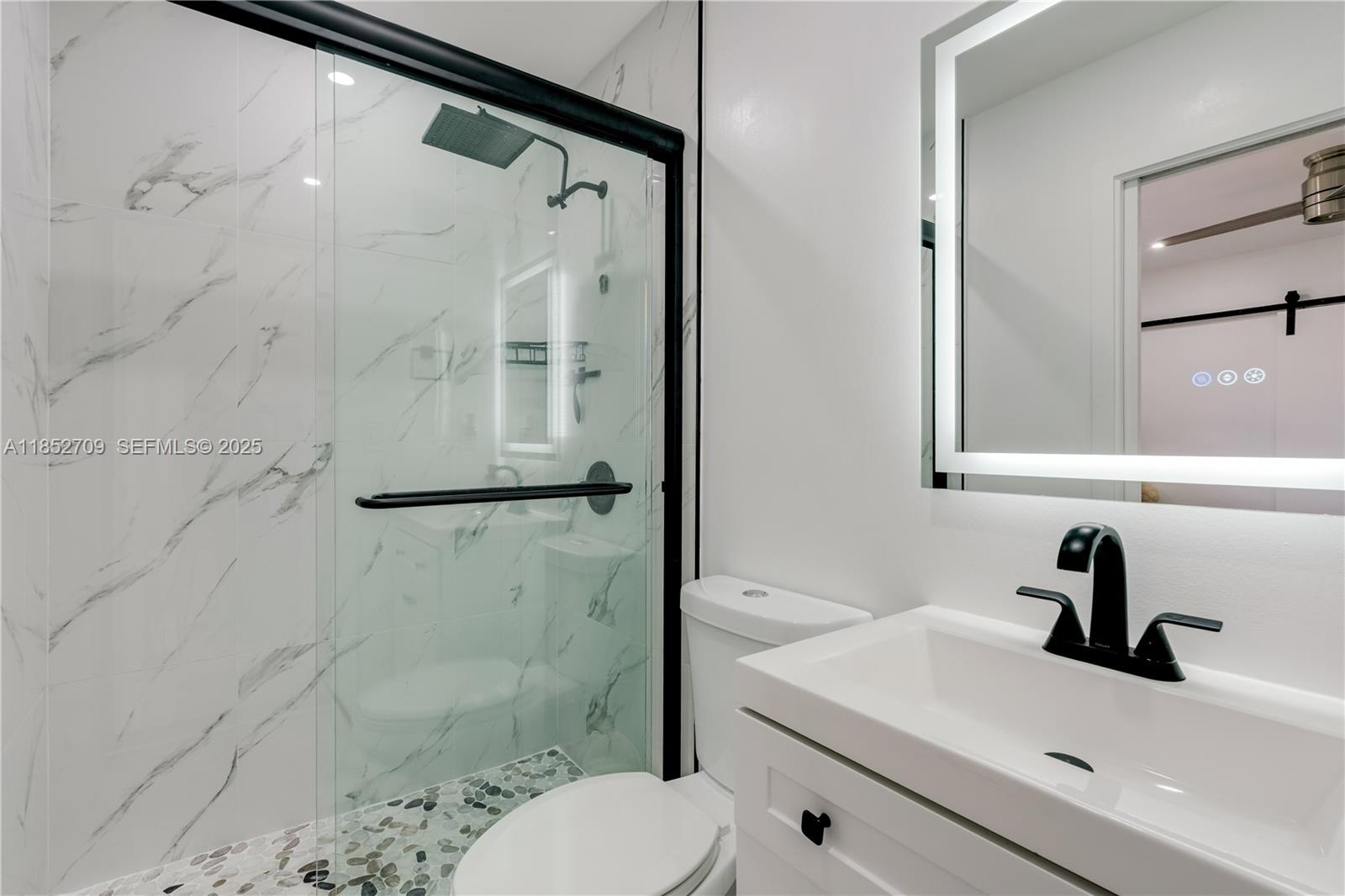 9311 Southwest 37th Street Miami, FL 33165 - Photo 20 of 39 a bathroom with a sink toilet and shower