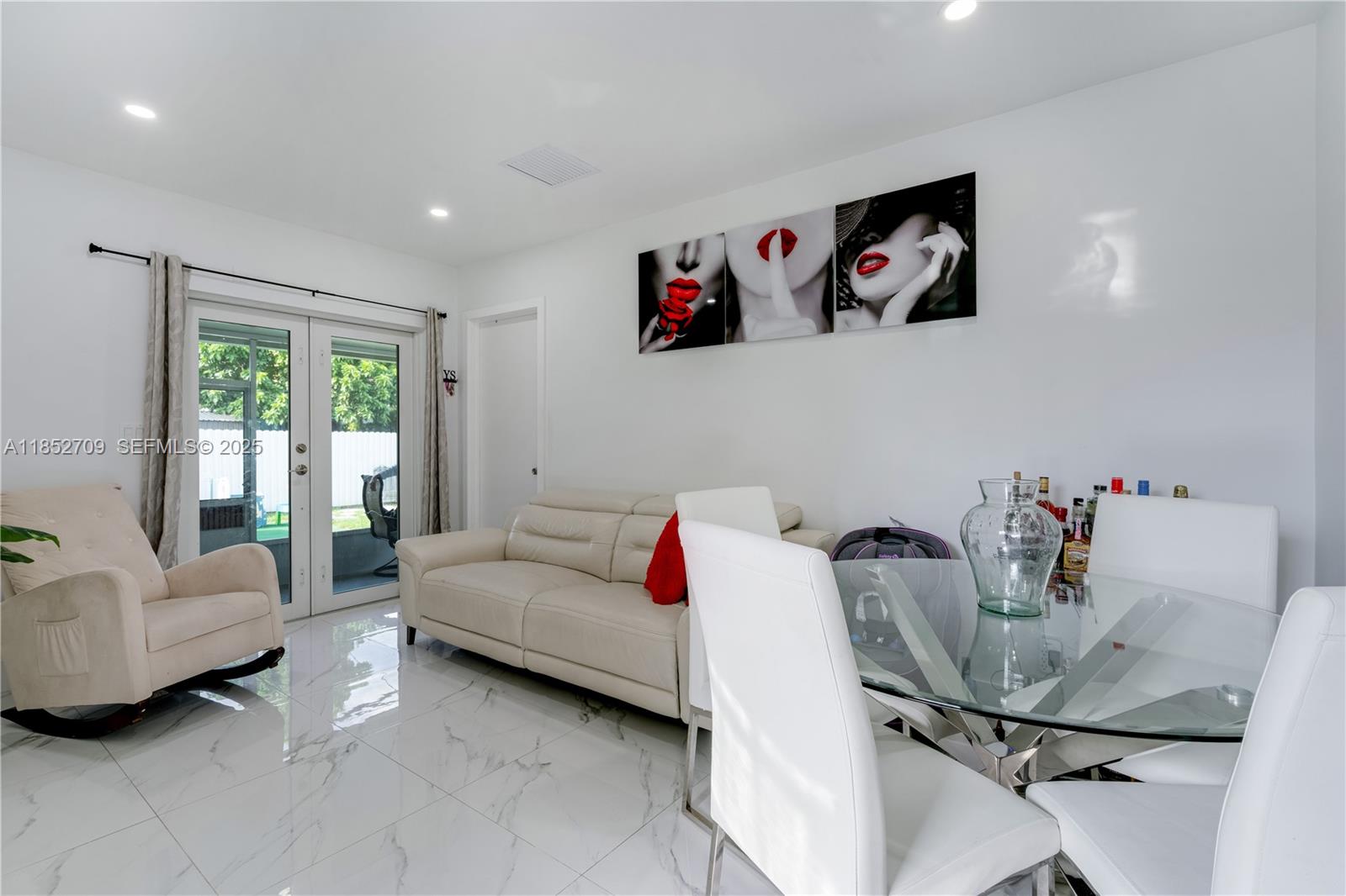 9311 Southwest 37th Street Miami, FL 33165 - Photo 23 of 39 a living room with furniture and a window