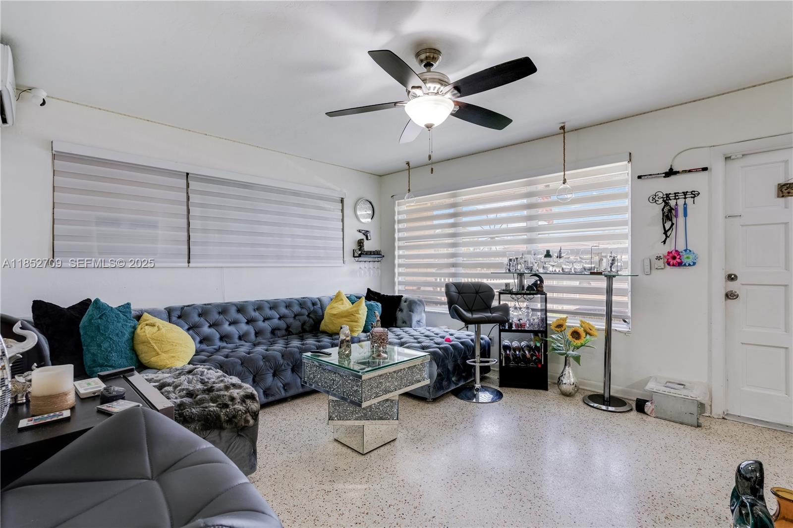9311 Southwest 37th Street Miami, FL 33165 - Photo 7 of 39 a living room with furniture and a flat screen tv