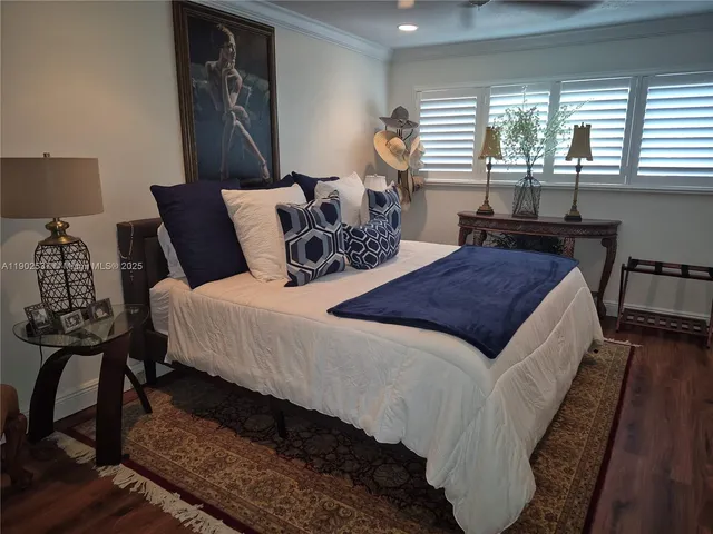 a bedroom with bed and window