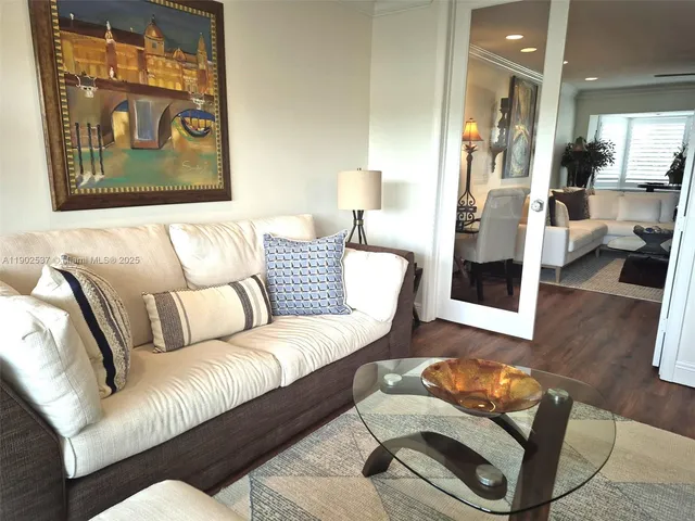 a living room with furniture and a rug