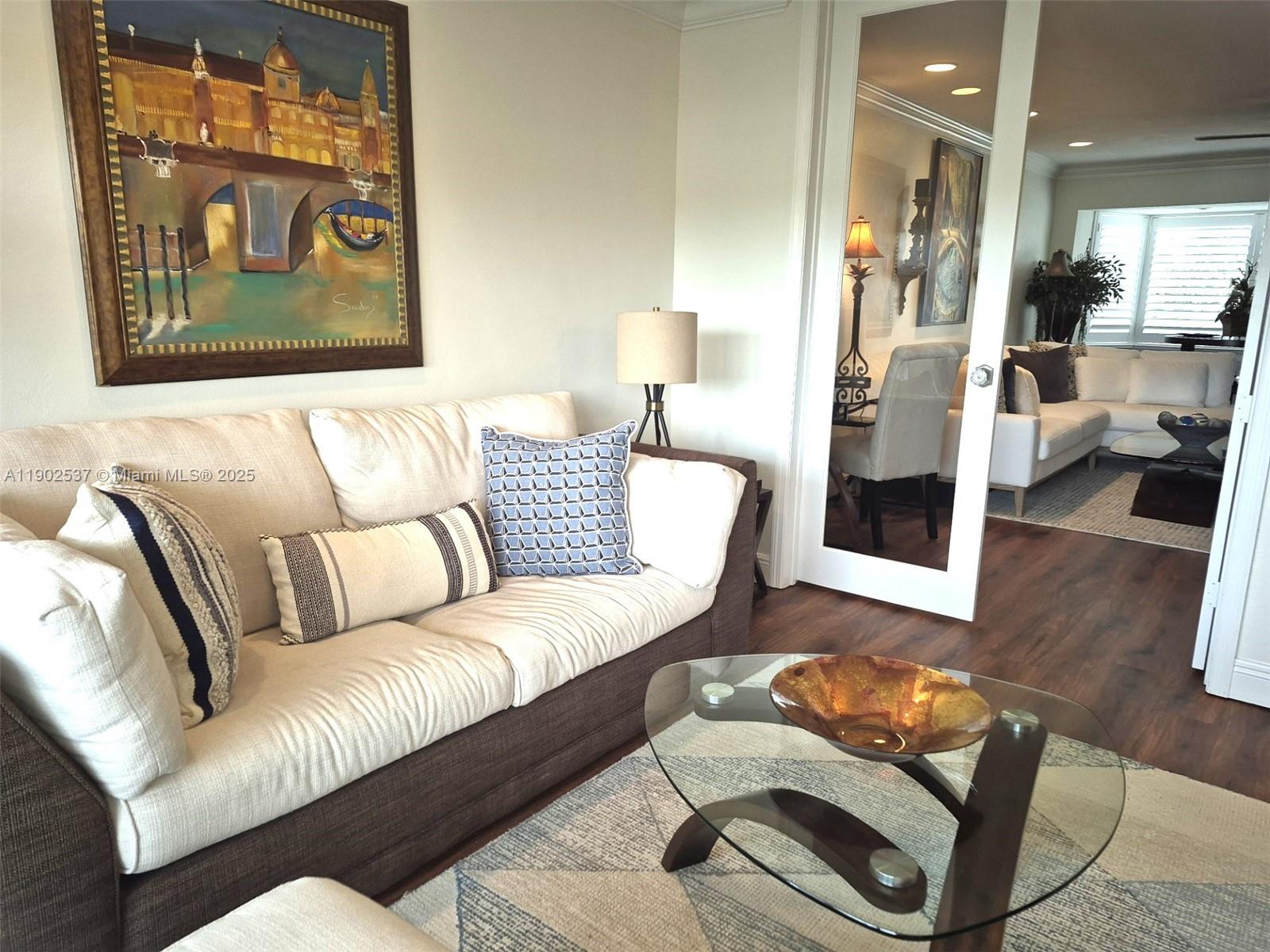 535 Hendricks Isle, Unit 306 Fort Lauderdale, FL 33301 - Photo 14 of 32 a living room with furniture and a rug