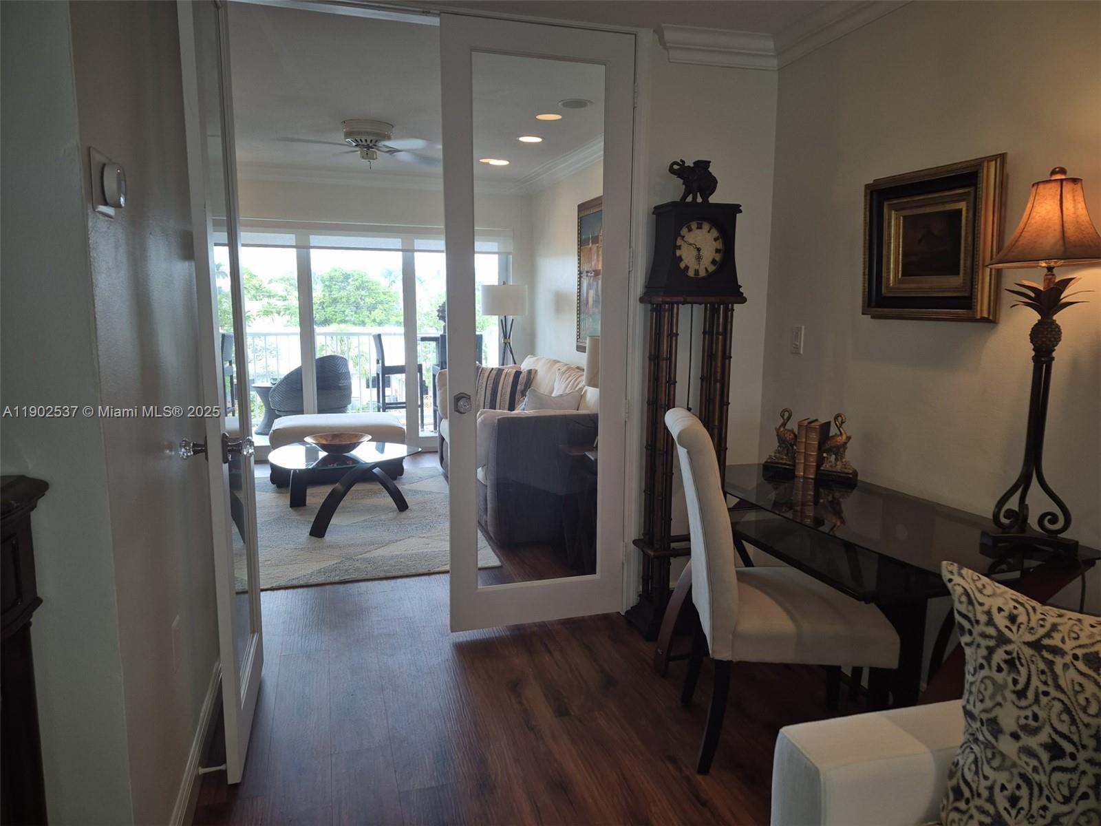 535 Hendricks Isle, Unit 306 Fort Lauderdale, FL 33301 - Photo 16 of 32 a living room with furniture and a flat screen tv