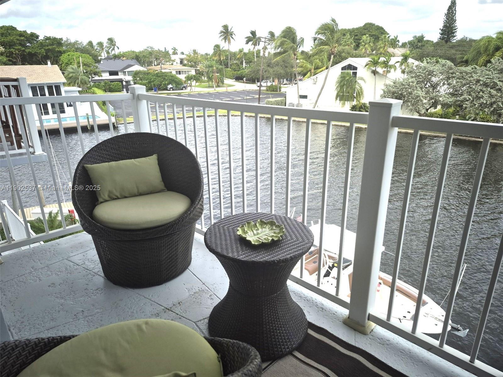 535 Hendricks Isle, Unit 306 Fort Lauderdale, FL 33301 - Photo 20 of 32 a view of a chairs and table in the balcony