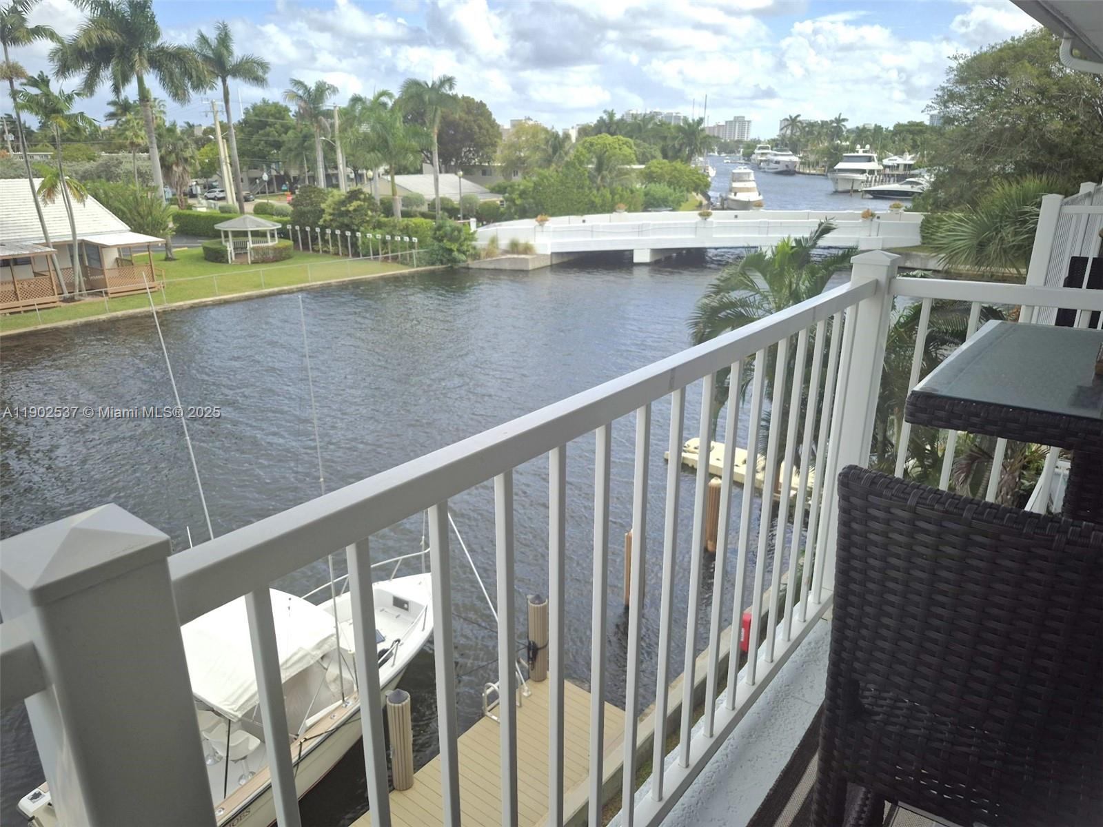 535 Hendricks Isle, Unit 306 Fort Lauderdale, FL 33301 - Photo 21 of 32 a view of a lake from a balcony