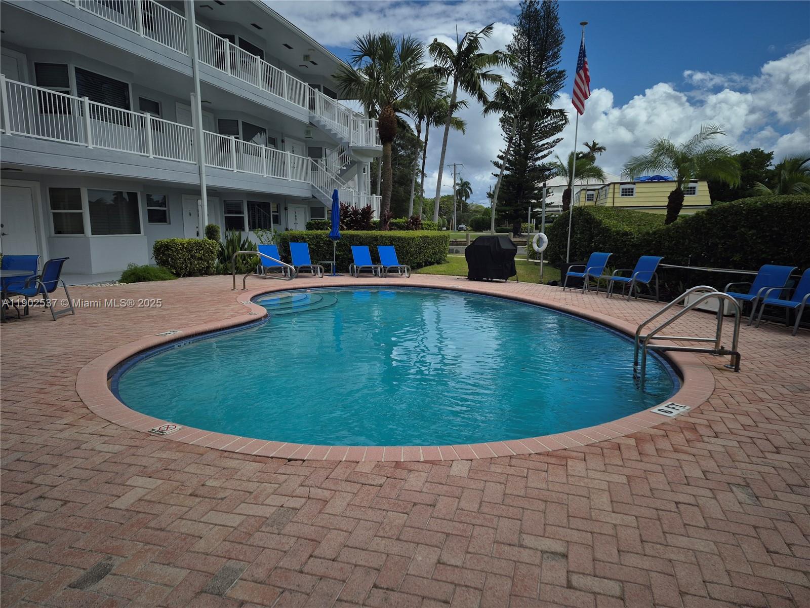 535 Hendricks Isle, Unit 306 Fort Lauderdale, FL 33301 - Photo 26 of 32 a view of outdoor space swimming pool and outdoor seating